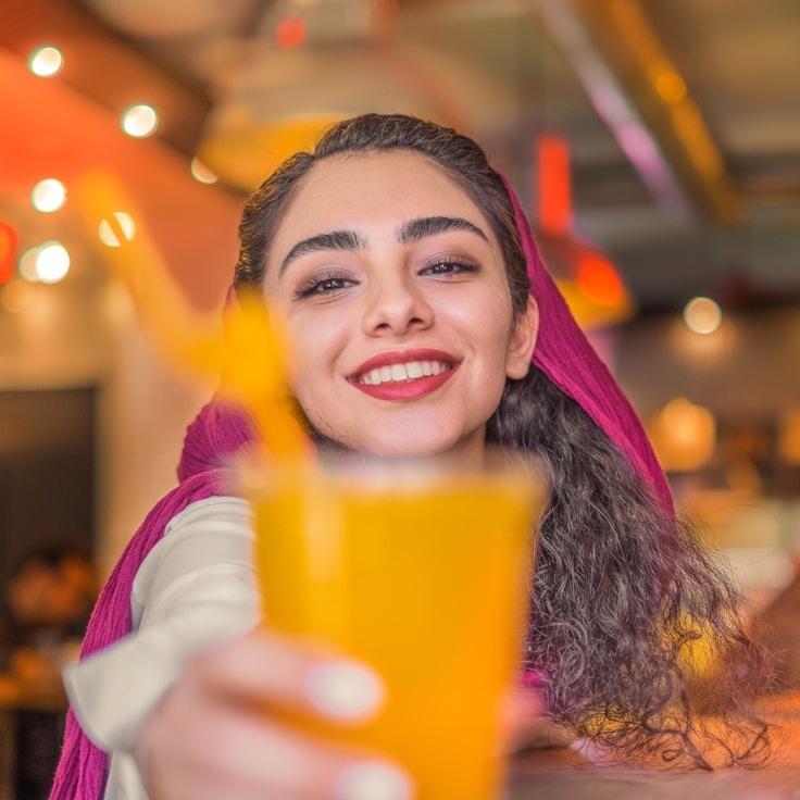 Alex Parker, Lead Design Curator at CrestOliveHaven, reviewing corporate floral arrangements